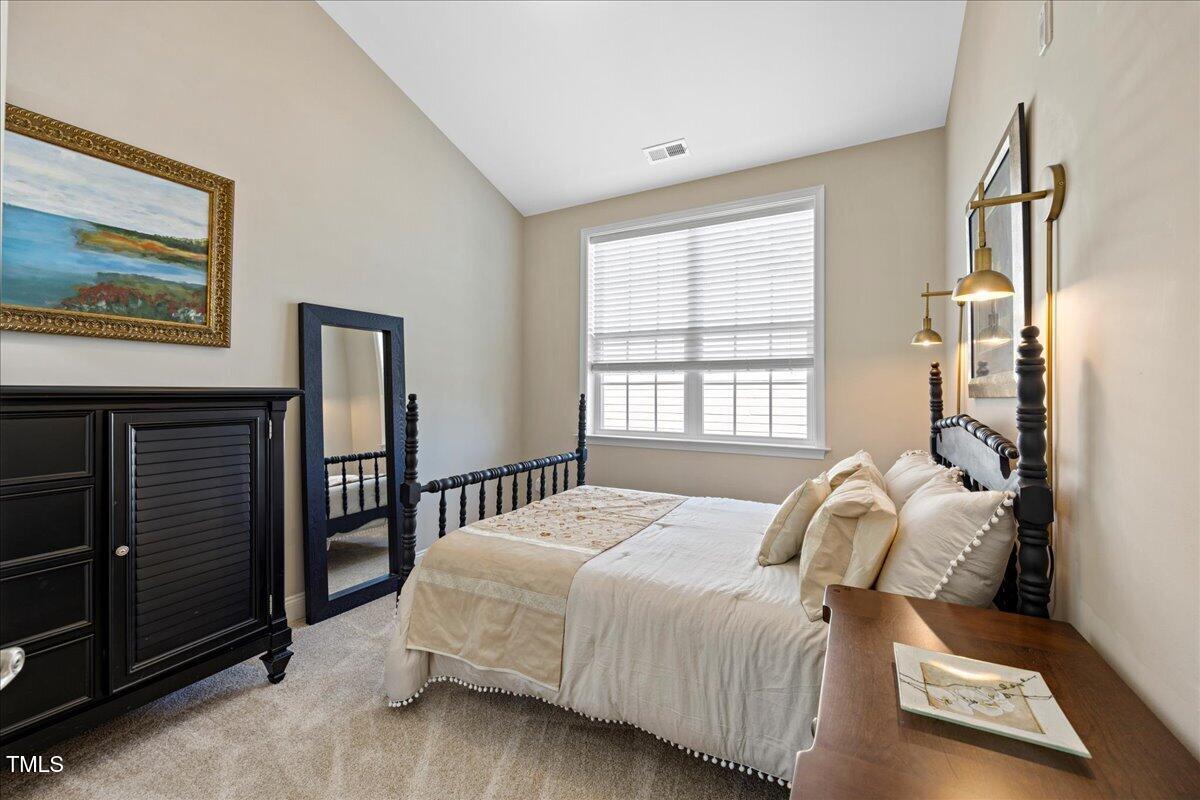 10520 Sablewood Drive, Unit 103 Raleigh, NC 27617 - Photo 21 of 38 a bedroom with a bed and window