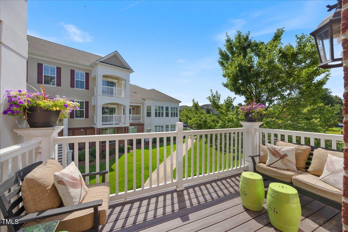 10520 Sablewood Drive, Unit 103 Raleigh, NC 27617 - Photo 30 of 38 a view of a two chairs on the deck