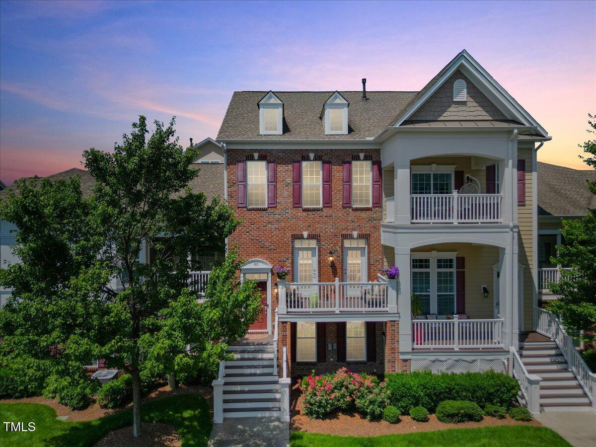 10520 Sablewood Drive, Unit 103 Raleigh, NC 27617 - Photo 33 of 38 a front view of a house with a yard