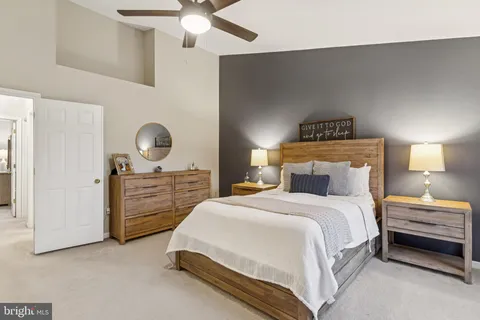 a bedroom with a bed and cabinets