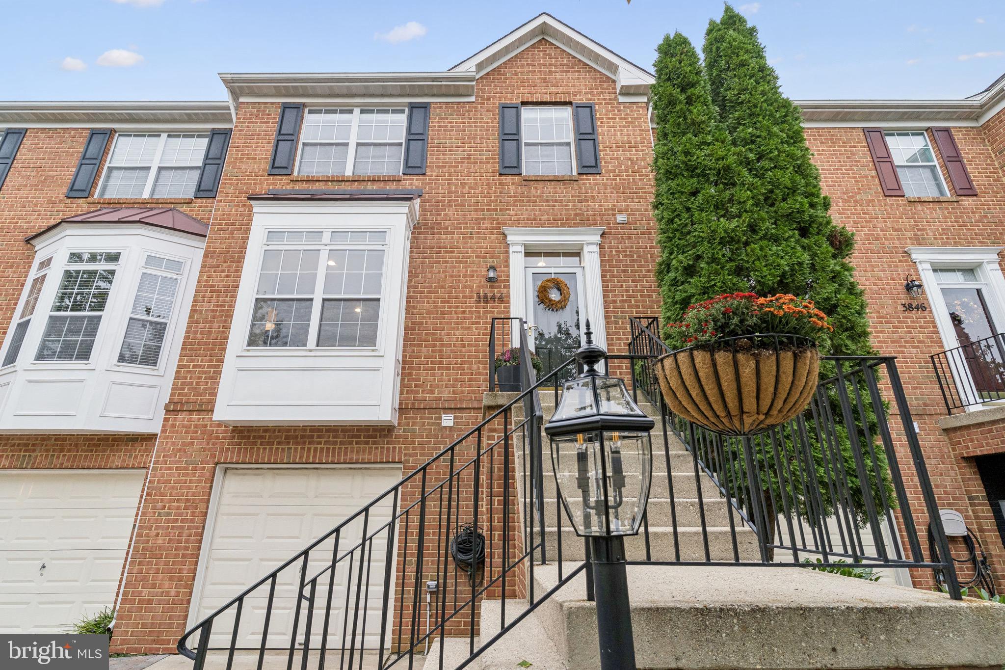 3844 Glebe Meadow Way Edgewater, MD 21037 - Photo 2 of 20 a view of a brick house with many windows
