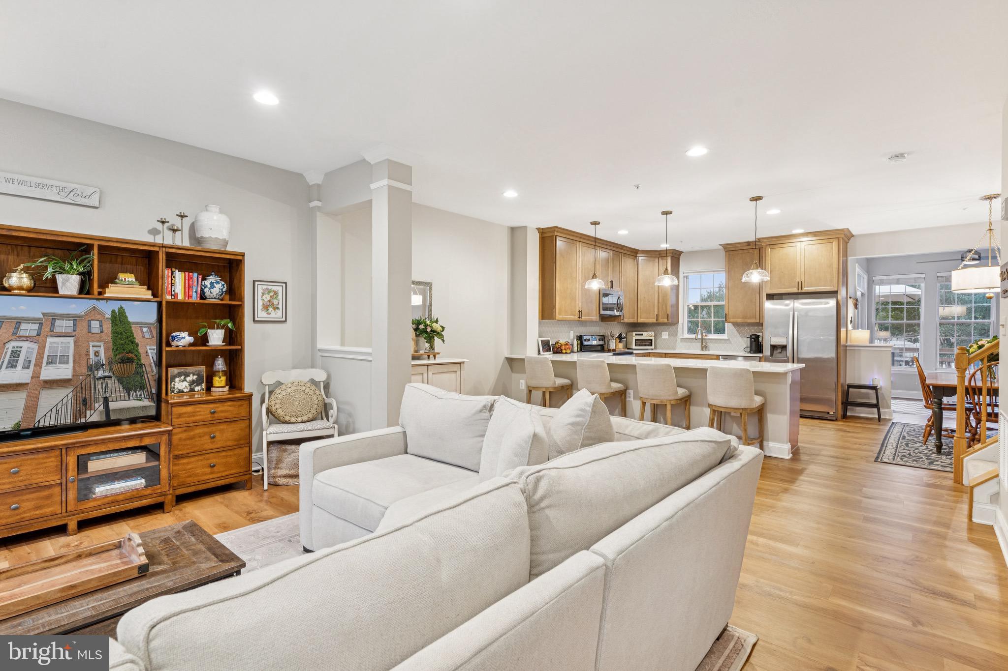 3844 Glebe Meadow Way Edgewater, MD 21037 - Photo 3 of 20 a living room with furniture and a kitchen view
