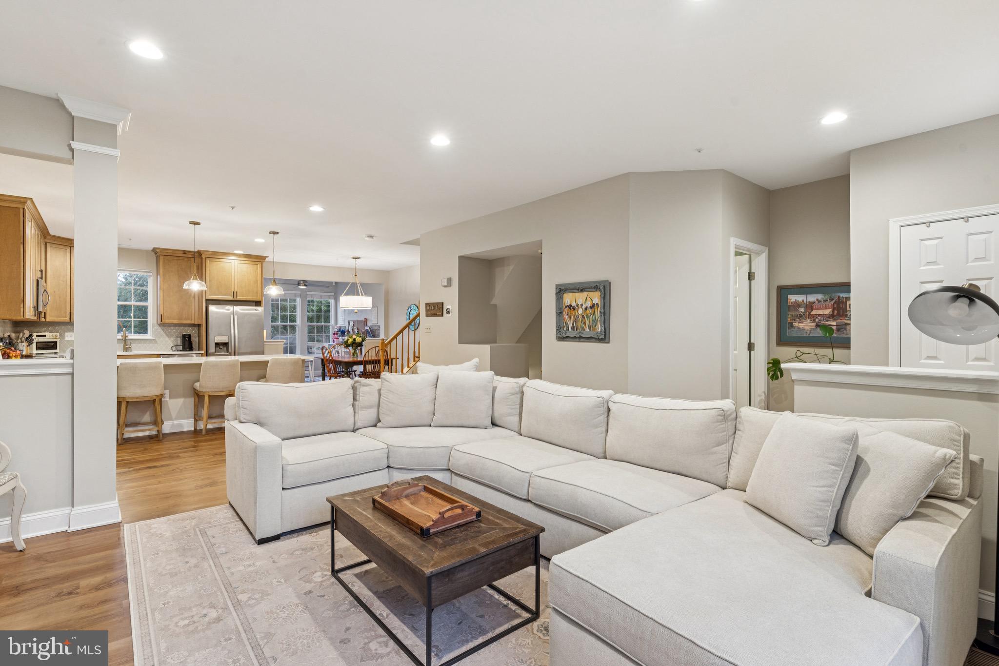3844 Glebe Meadow Way Edgewater, MD 21037 - Photo 4 of 20 a living room with furniture white walls and kitchen view