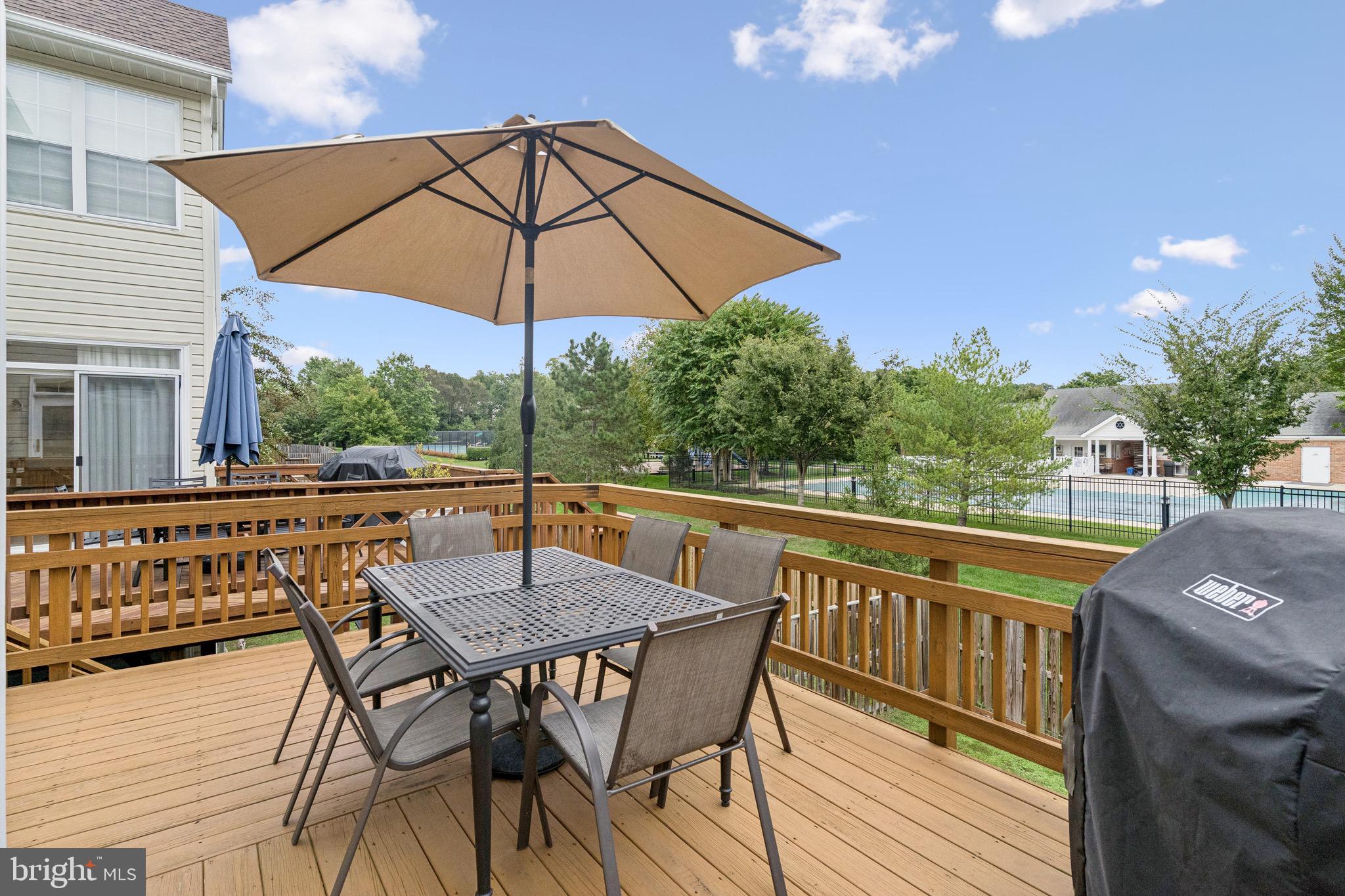 3844 Glebe Meadow Way Edgewater, MD 21037 - Photo 8 of 20 a view of deck with furniture and umbrella