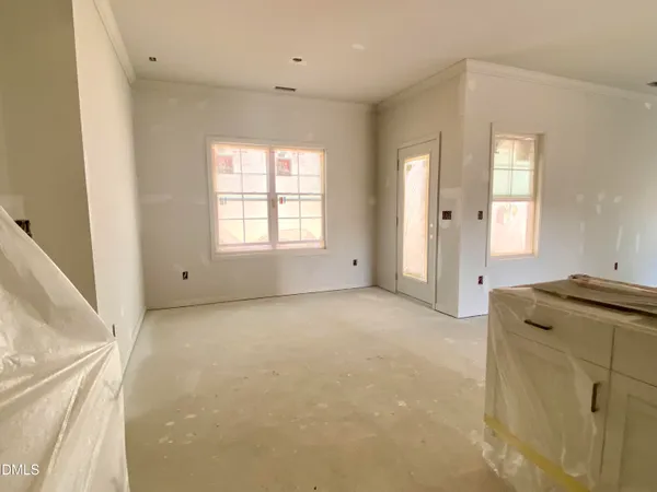 a view of a livingroom with a kitchen