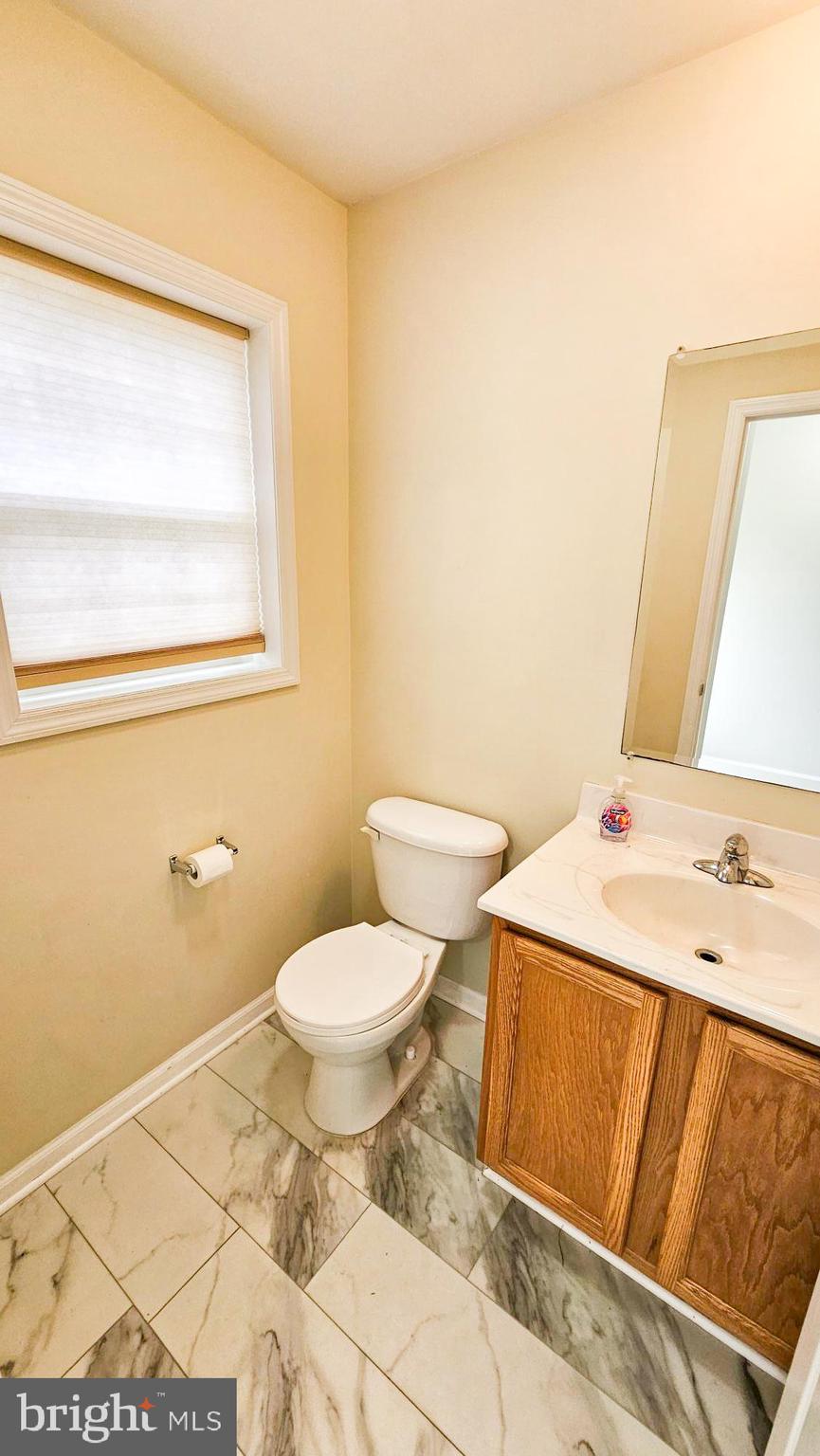 380 Radio Road, Unit B 6 Little Egg Harbor, NJ 08087 - Photo 15 of 33 a bathroom with a sink a toilet and a mirror