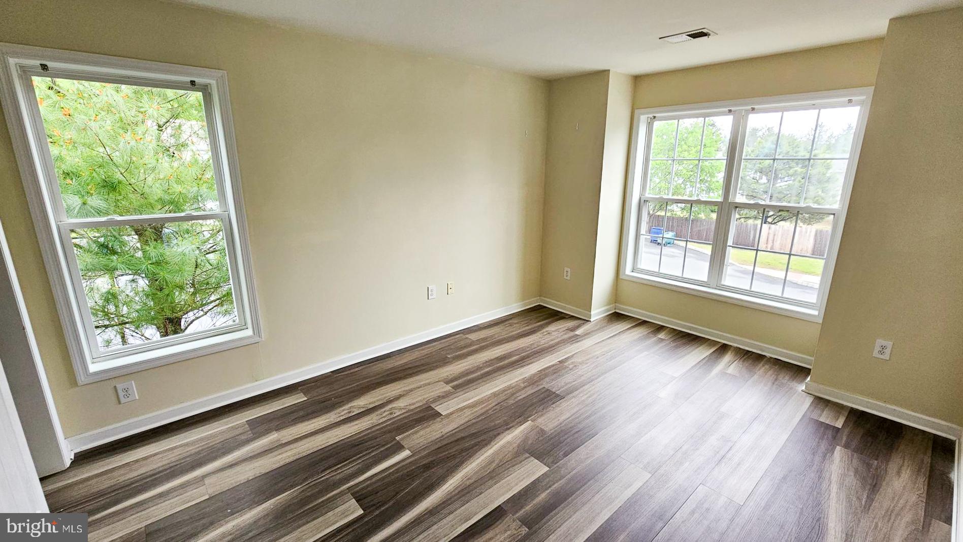 380 Radio Road, Unit B 6 Little Egg Harbor, NJ 08087 - Photo 18 of 33 a view of an empty room with wooden floor and a window