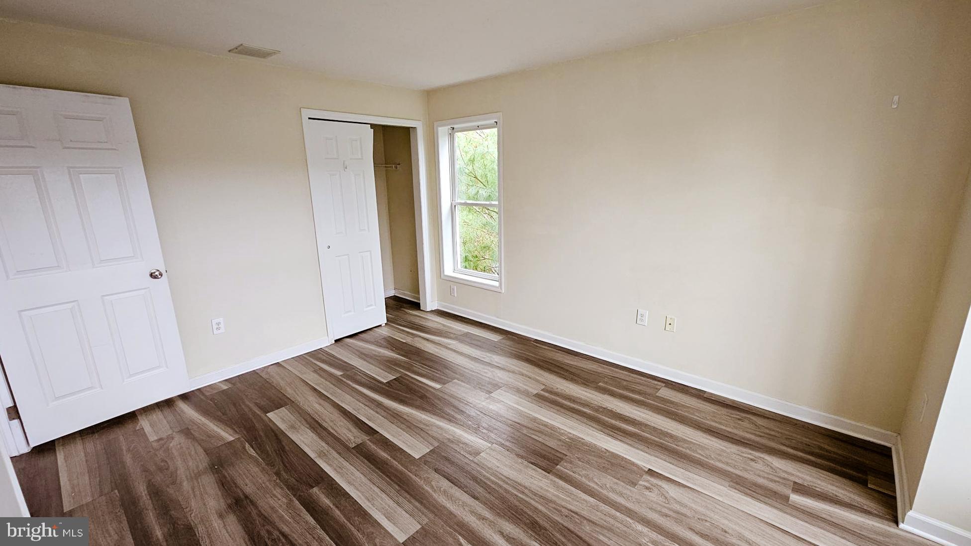 380 Radio Road, Unit B 6 Little Egg Harbor, NJ 08087 - Photo 19 of 33 a view of empty room with wooden floor and fan