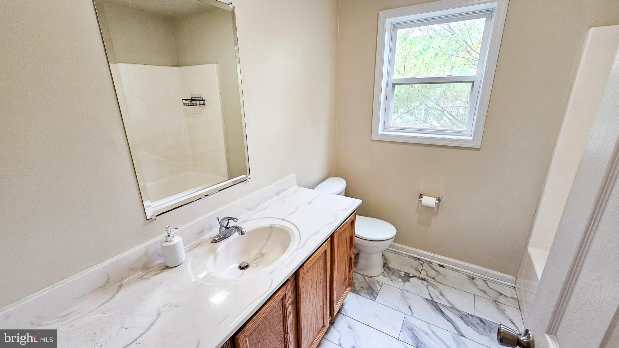 380 Radio Road, Unit B 6 Little Egg Harbor, NJ 08087 - Photo 21 of 33 a bathroom with a sink a toilet and shower
