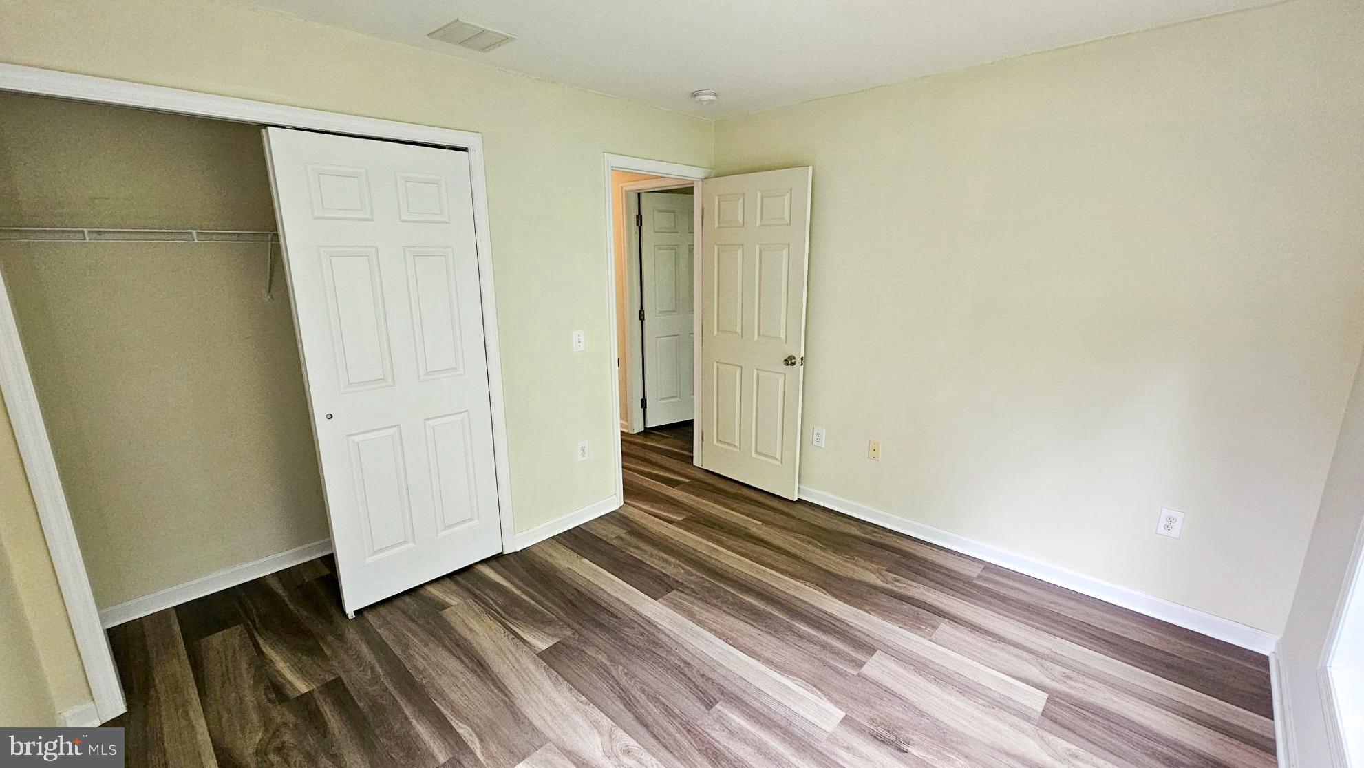 380 Radio Road, Unit B 6 Little Egg Harbor, NJ 08087 - Photo 24 of 33 a view of an empty room with wooden floor