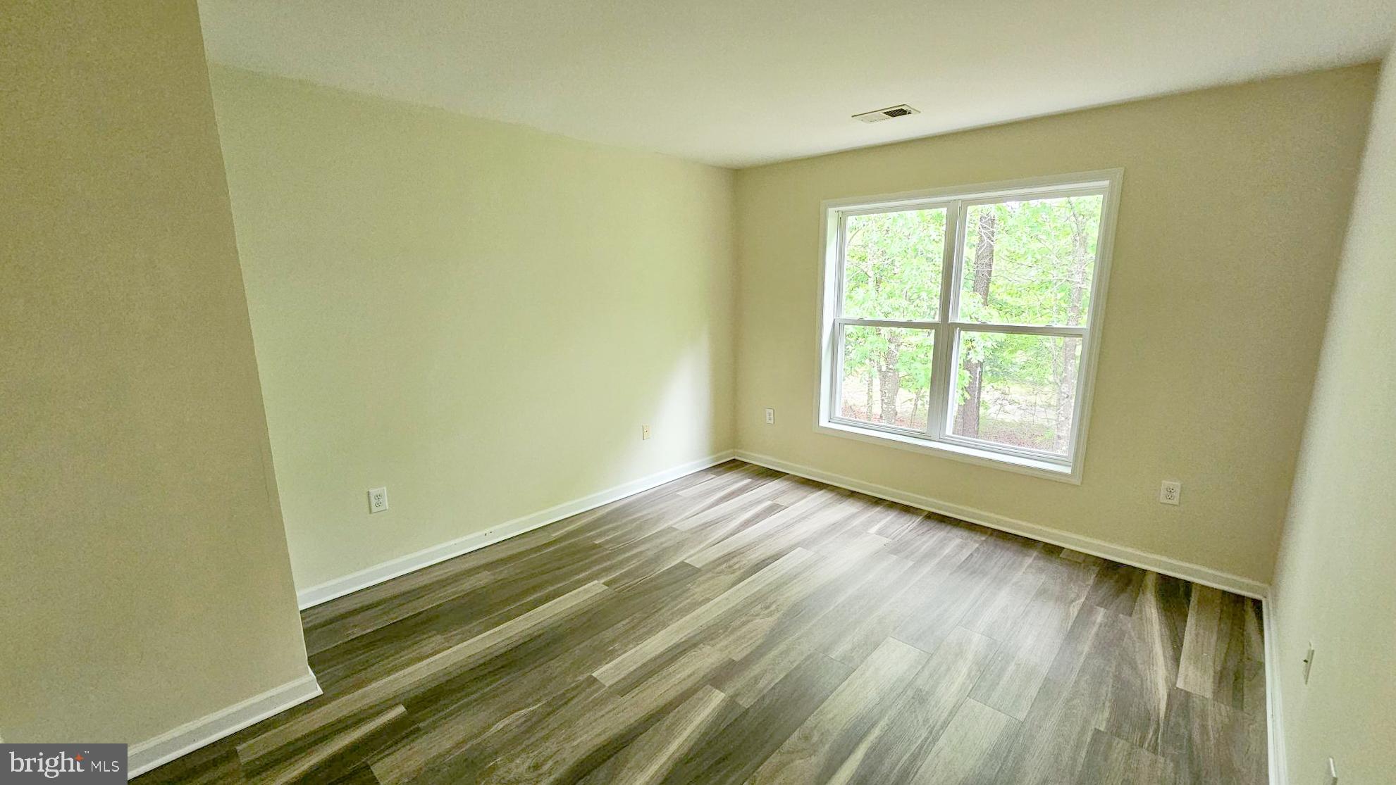 380 Radio Road, Unit B 6 Little Egg Harbor, NJ 08087 - Photo 25 of 33 a view of an empty room and wooden floor