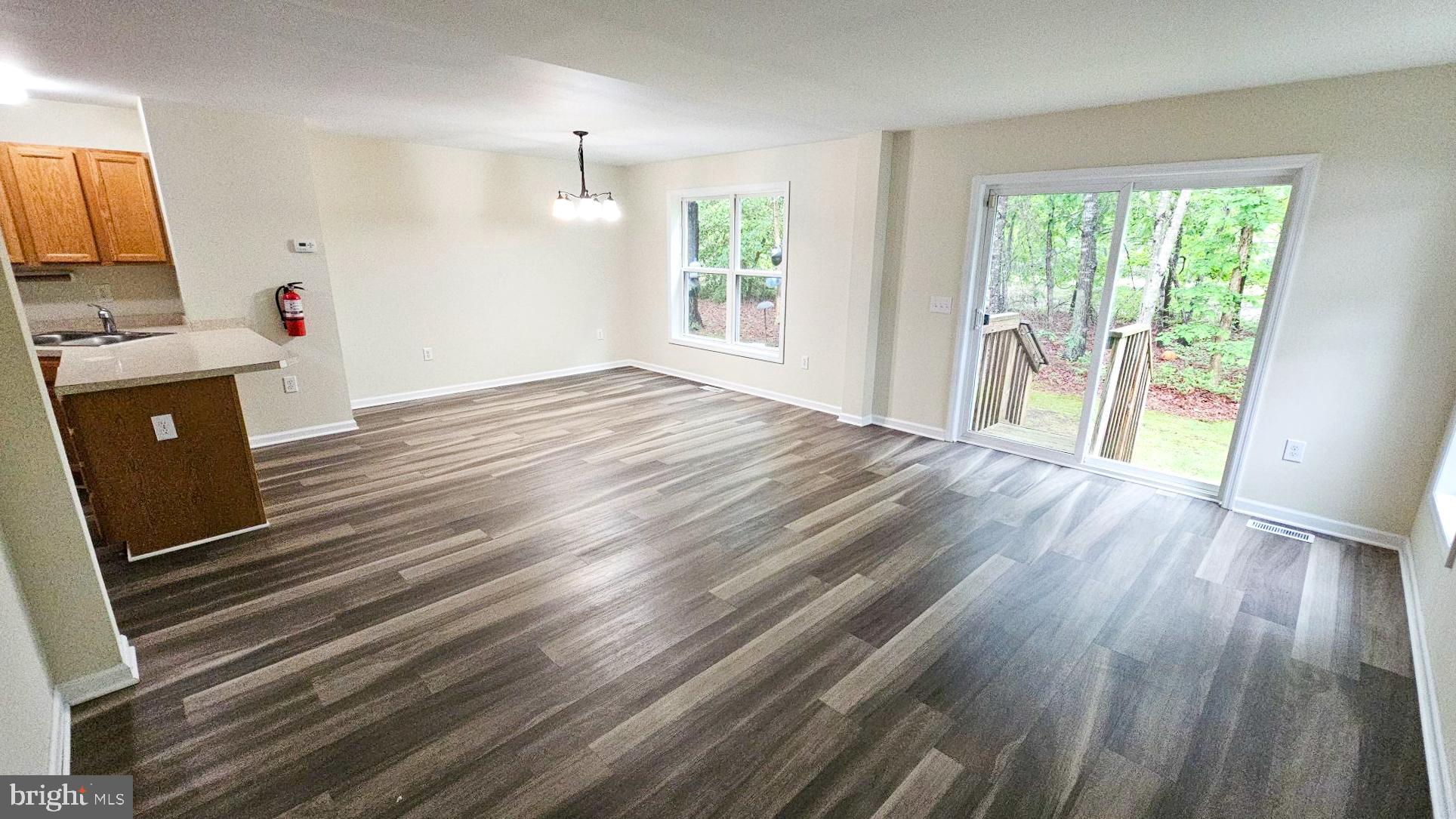 380 Radio Road, Unit B 6 Little Egg Harbor, NJ 08087 - Photo 7 of 33 a view of a livingroom with wooden floor
