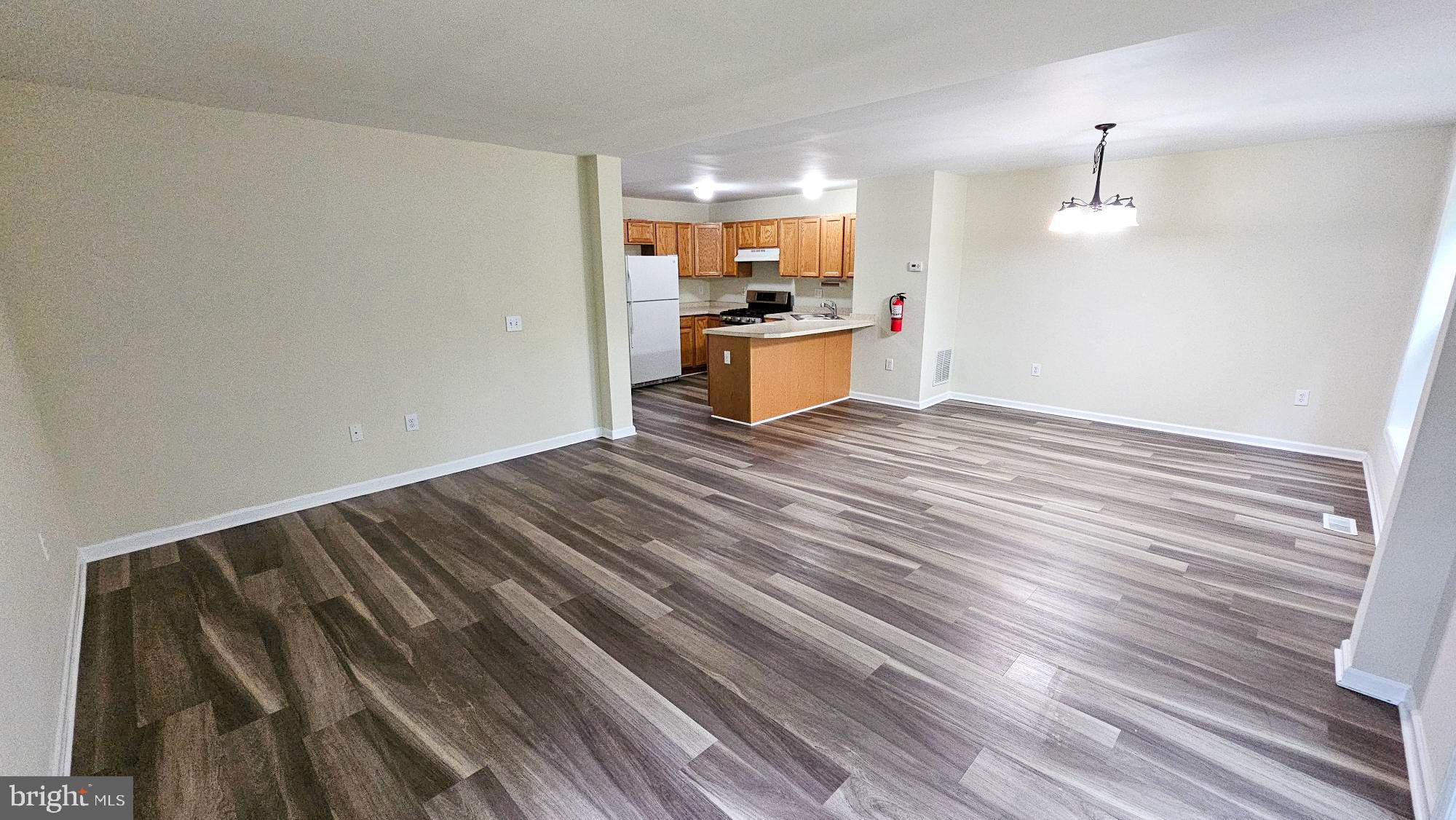 380 Radio Road, Unit B 6 Little Egg Harbor, NJ 08087 - Photo 9 of 33 a view of kitchen and wooden floor