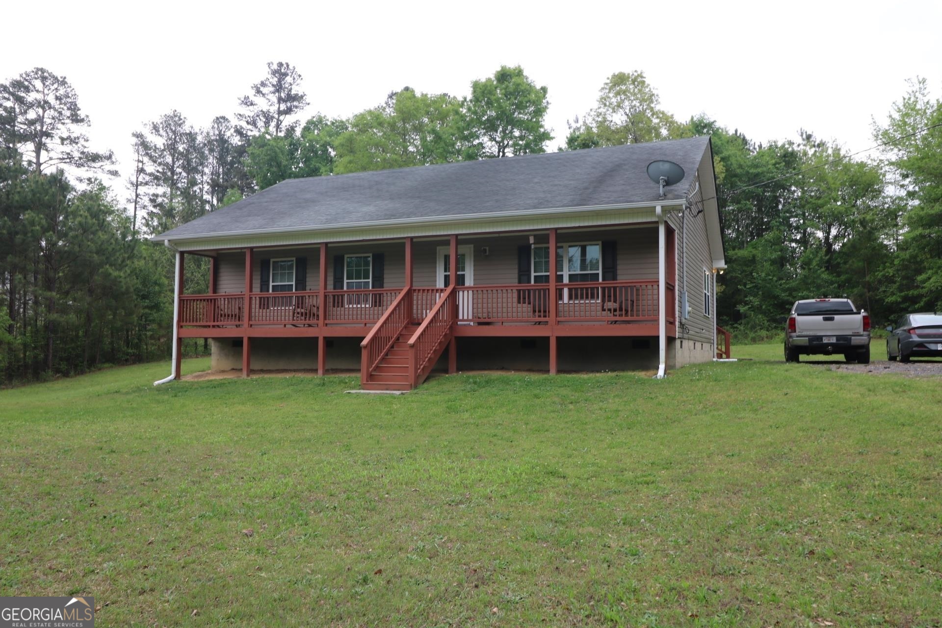 129 Miller Farm Road Taylorsville, GA 30178 - Photo 1 of 1 a front view of a house with a garden and porch