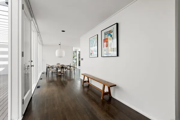 a view of a dining room with furniture and a large window