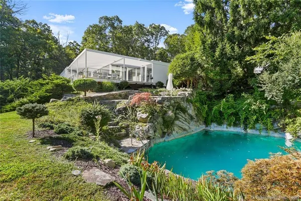 a house with trees in the background