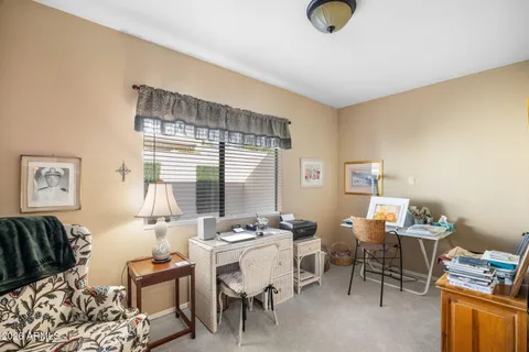 a living room with furniture and a window