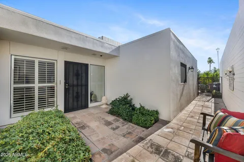 a view of backyard with patio