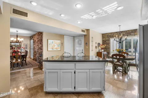 a view of a living room and kitchen