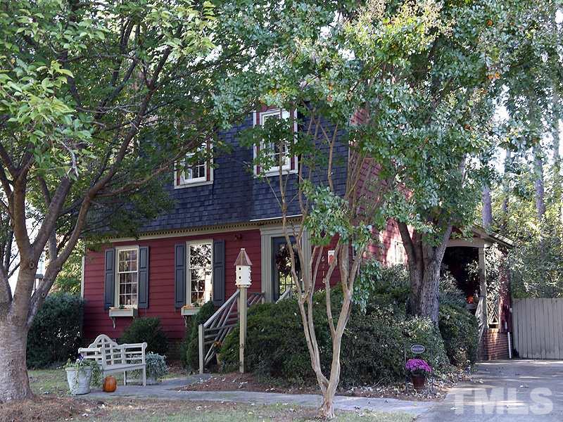 6216 Wynbrook Way Raleigh, NC 27612 - Photo 1 of 19 a front view of a house with garden