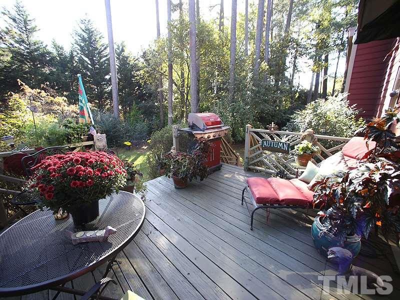 6216 Wynbrook Way Raleigh, NC 27612 - Photo 16 of 19 a view of a backyard with furniture and a fire pit