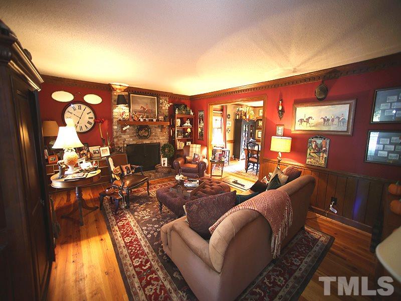 6216 Wynbrook Way Raleigh, NC 27612 - Photo 4 of 19 a living room with furniture and wooden floor