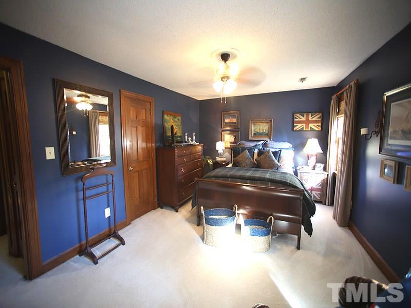 6216 Wynbrook Way Raleigh, NC 27612 - Photo 10 of 19 a bed room with a bed and furniture