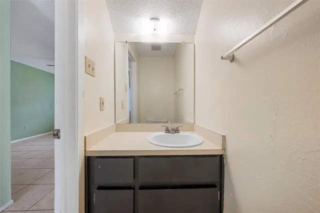 a view of a livingroom with a ceiling fan and window
