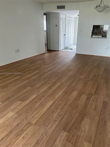 a view of a livingroom with wooden floor