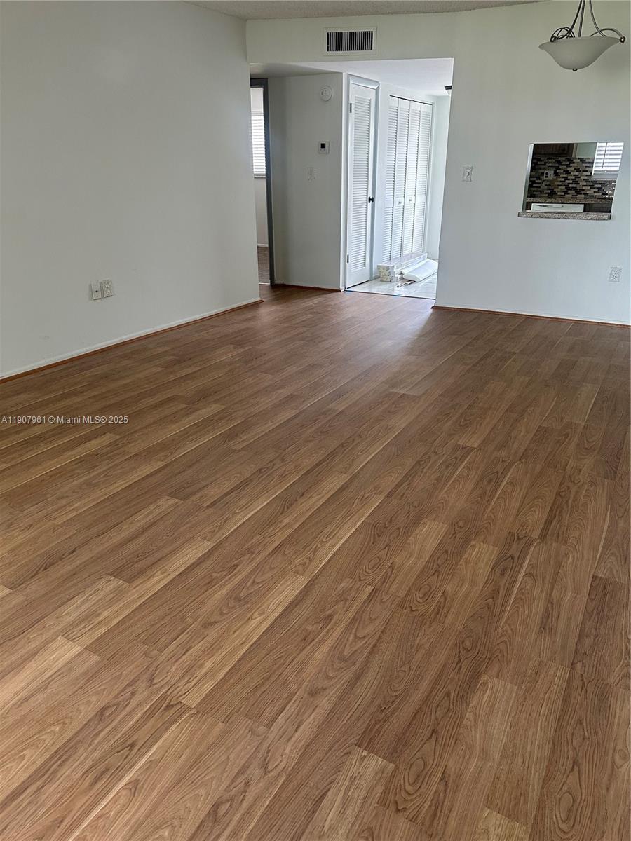 a view of a livingroom with wooden floor