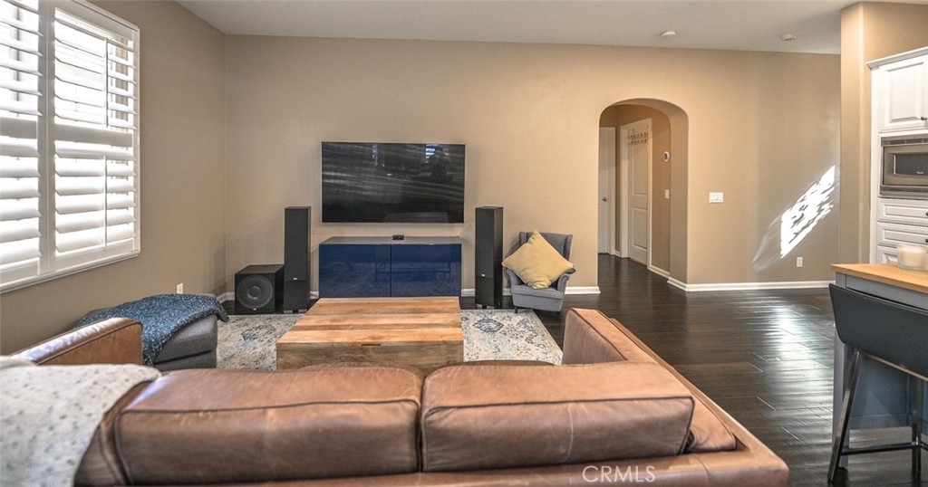 64 Scarlet Bloom Irvine, CA 92618 - Photo 13 of 22 a living room with furniture and a flat screen tv