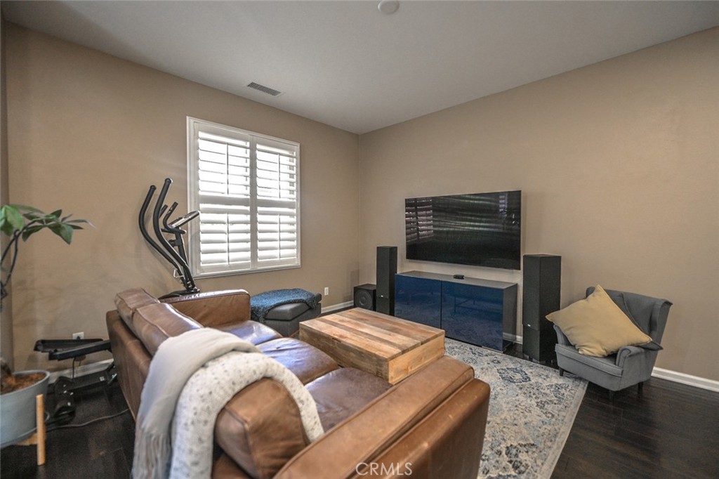 64 Scarlet Bloom Irvine, CA 92618 - Photo 14 of 22 a bedroom with a bed and a television