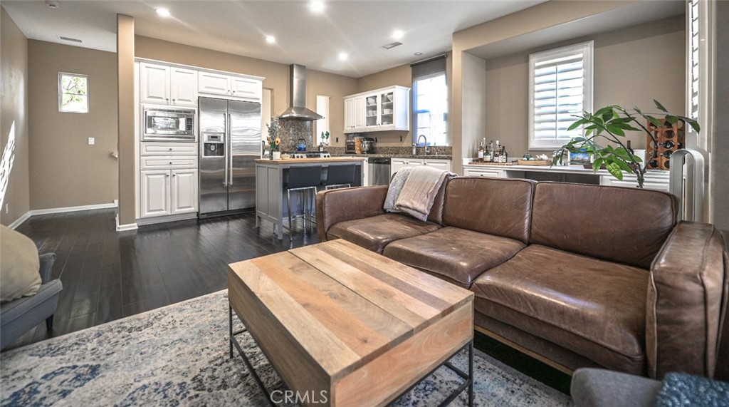 64 Scarlet Bloom Irvine, CA 92618 - Photo 15 of 22 a living room with furniture and a large window