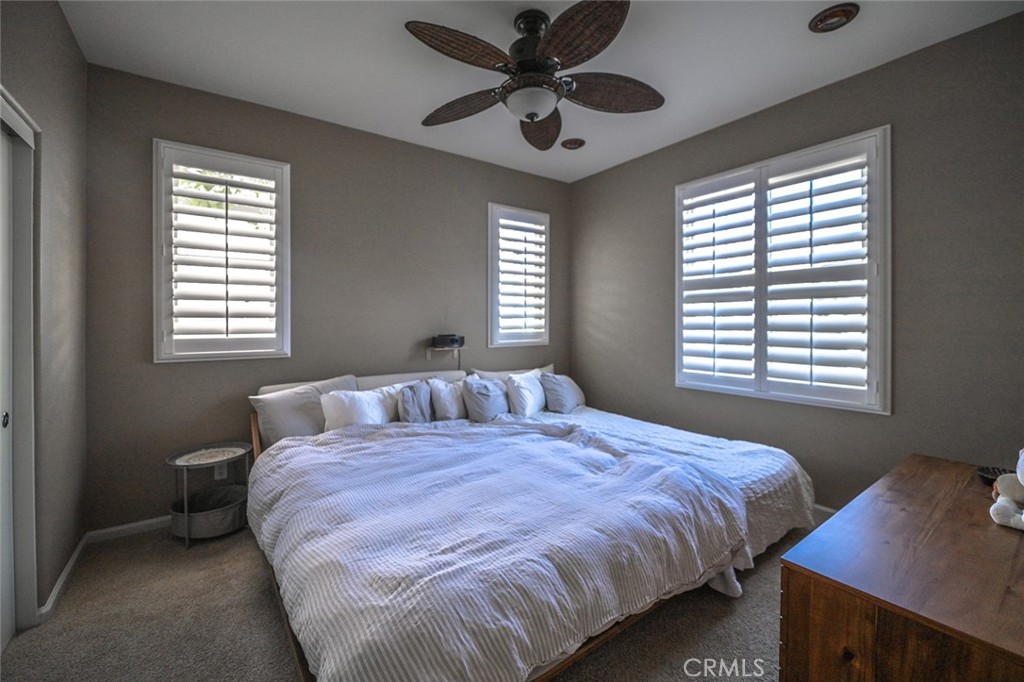 64 Scarlet Bloom Irvine, CA 92618 - Photo 18 of 22 a bedroom with a bed and a window
