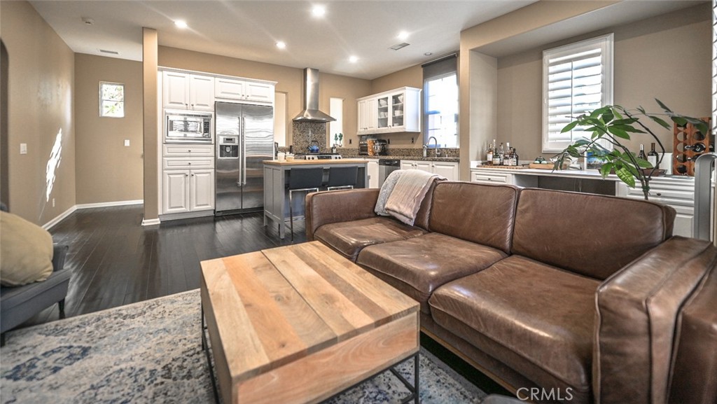 64 Scarlet Bloom Irvine, CA 92618 - Photo 19 of 22 a living room with furniture and a large window