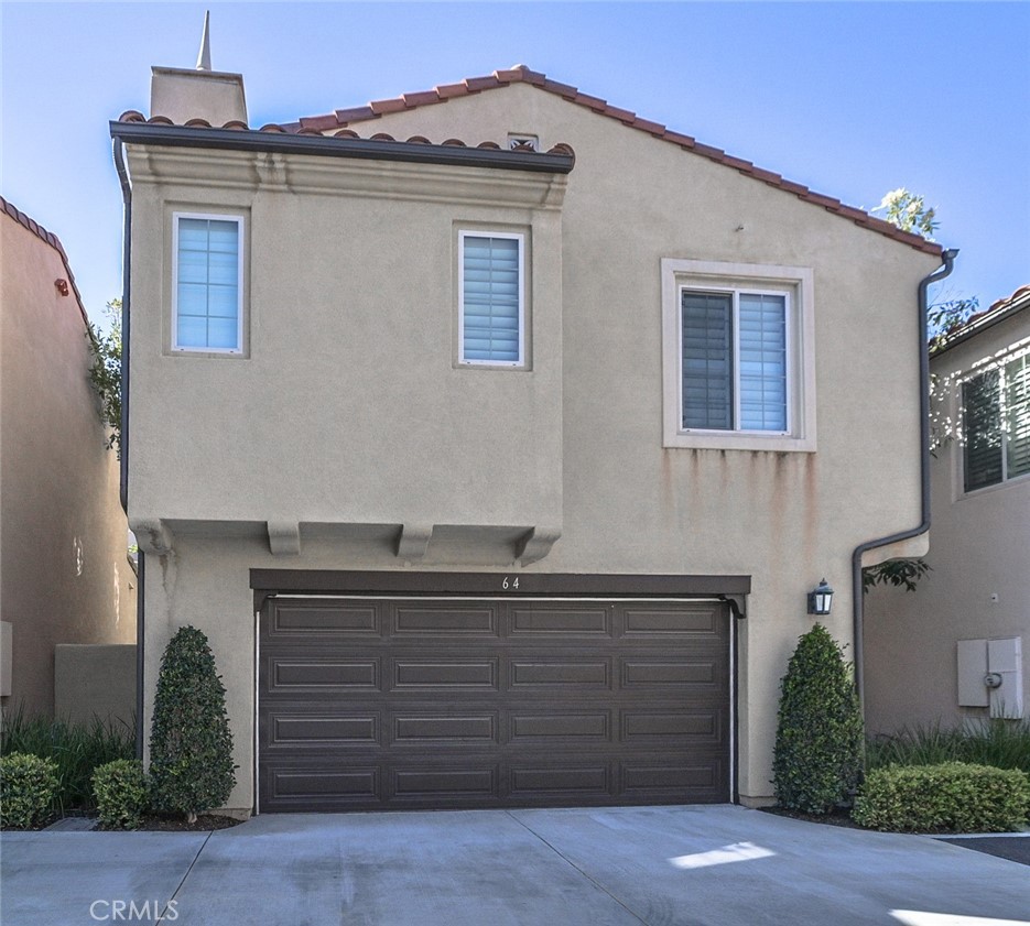 64 Scarlet Bloom Irvine, CA 92618 - Photo 2 of 22 a front view of house with yard