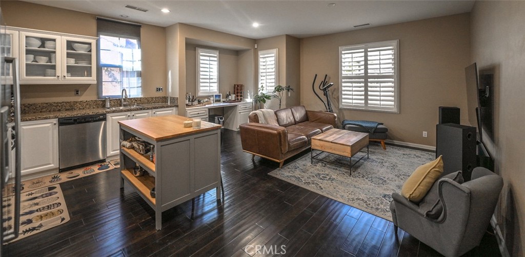 64 Scarlet Bloom Irvine, CA 92618 - Photo 6 of 22 a living room with furniture and a flat screen tv
