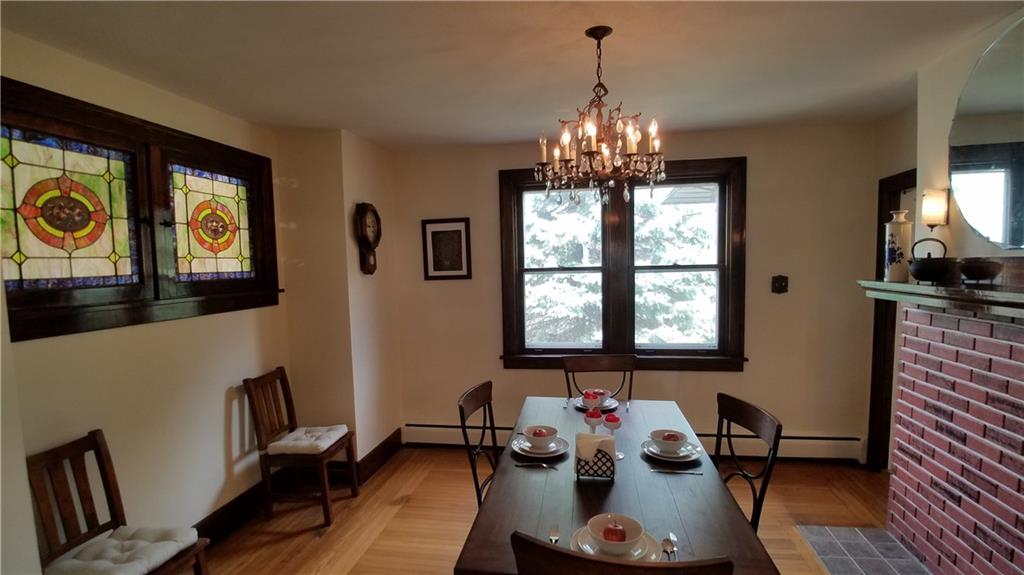 104 Perry View Avenue Pittsburgh, PA 15214 - Photo 8 of 25 Natural light & notice the custom pattern hard wood flooring.