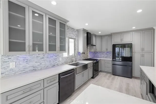a kitchen with a sink stove and refrigerator