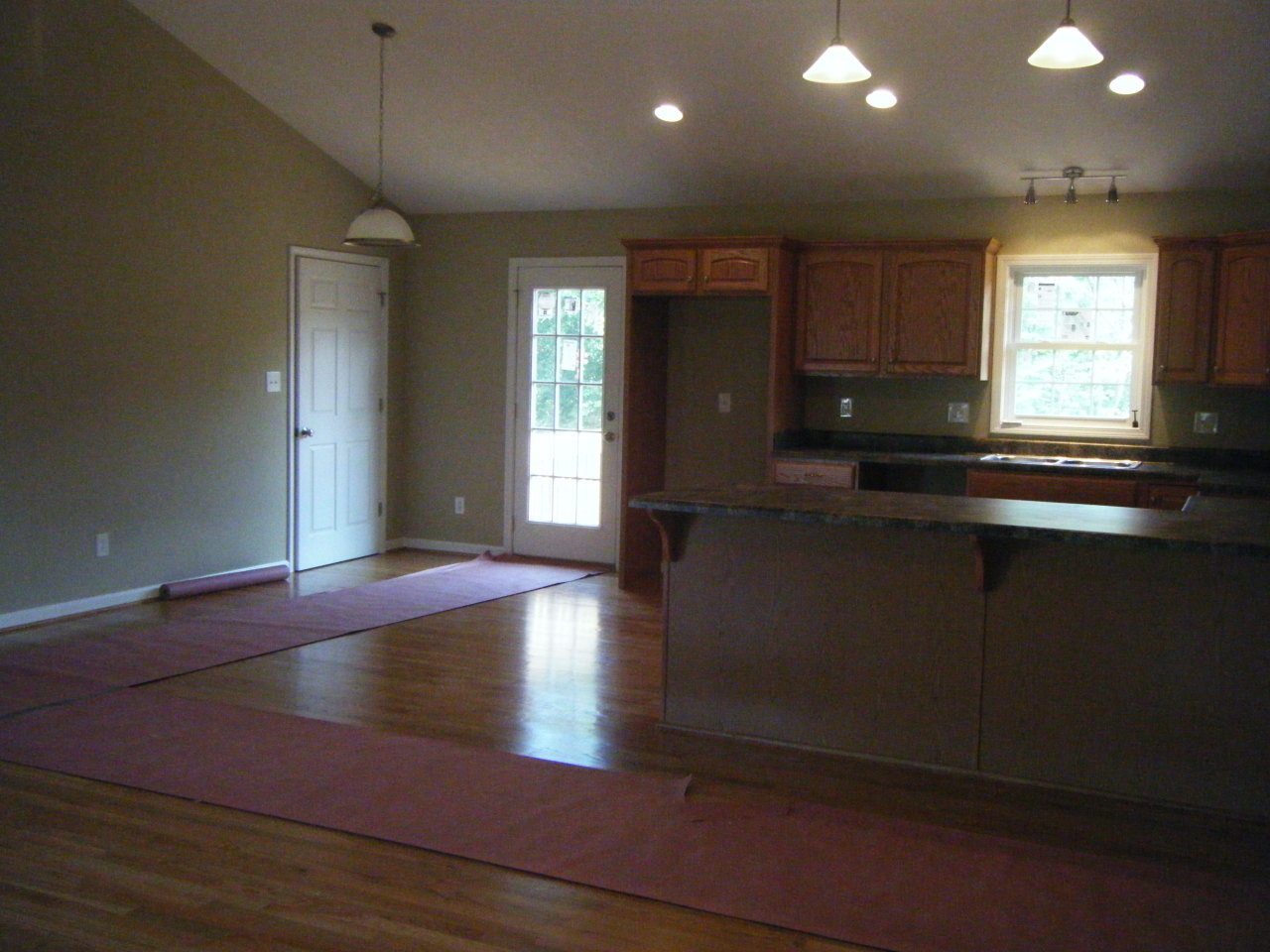 3 Goodview Road Goodview, VA 24095 - Photo 4 of 7 a kitchen with kitchen island granite countertop a sink window and cabinets