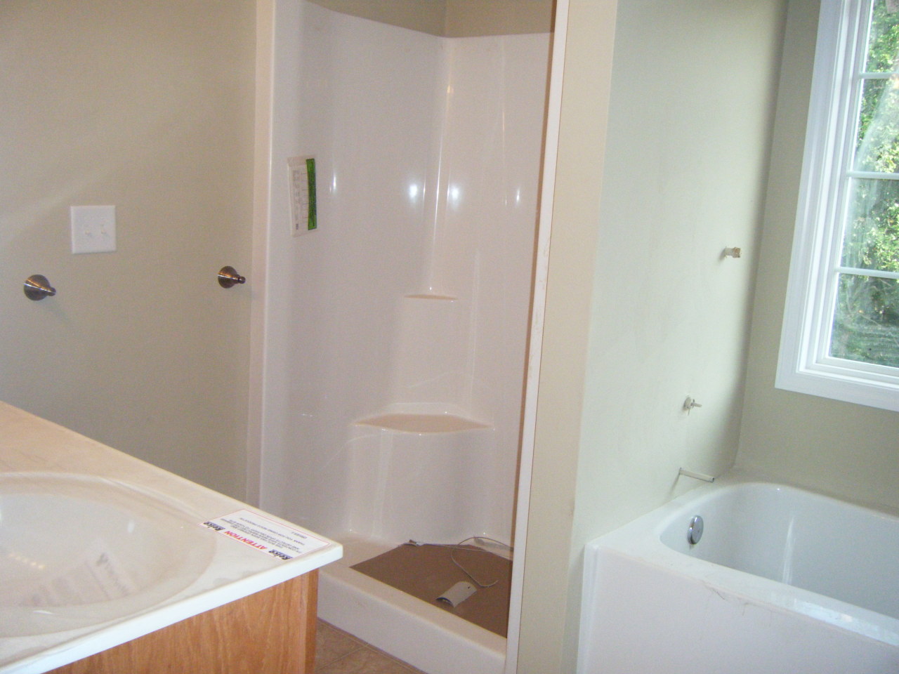 3 Goodview Road Goodview, VA 24095 - Photo 5 of 7 a bathroom with a tub a sink and a shower