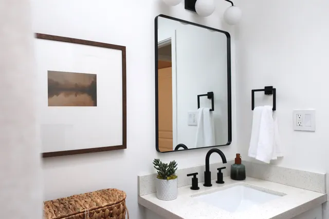 a bathroom with a sink and a mirror