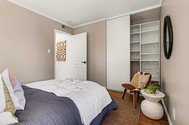 a bedroom with a bed and furniture