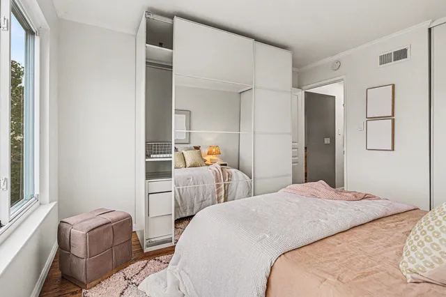 a bedroom with a bed and a couch