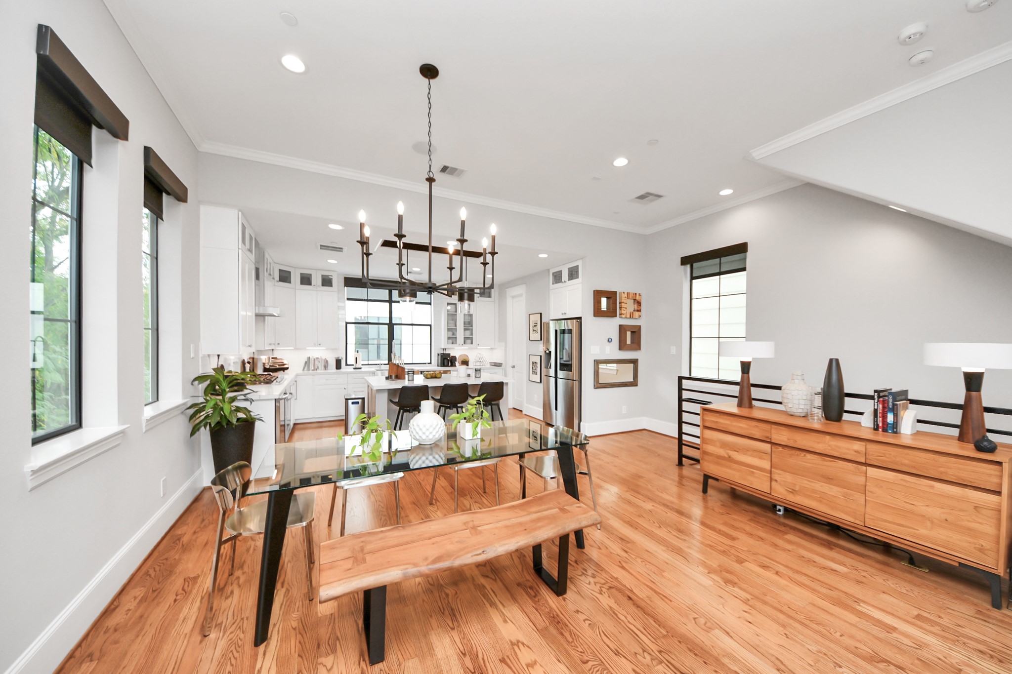 2765 Freund Street Houston, TX 77003 - Photo 12 of 44 a living room with kitchen island furniture and a wooden floor