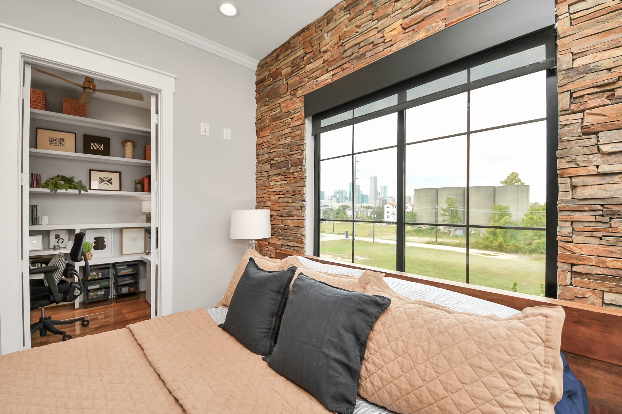 2765 Freund Street Houston, TX 77003 - Photo 20 of 44 Discover a spacious office converted from an oversized closet, featuring ample built-in storage and breathtaking views. It could easily be converted to a closet or nursery!