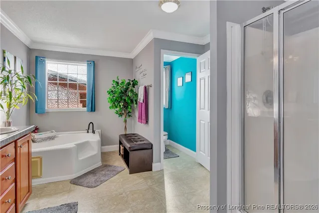 a bathroom with a bathtub sink and mirror