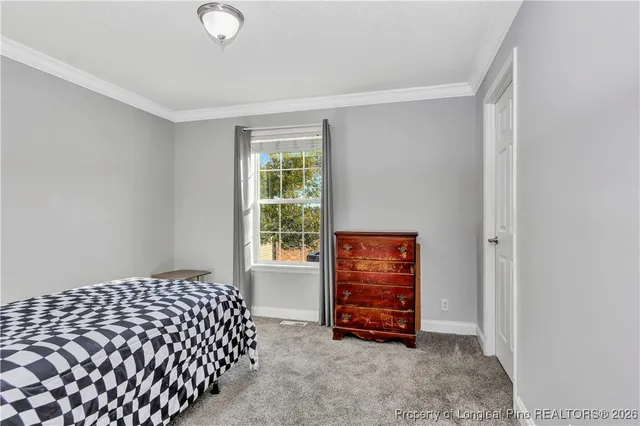 a room with a bed and a window