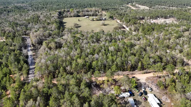 an aerial view of house with yard