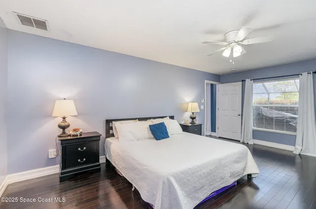 a bedroom with a bed and a lamp